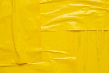 Blank yellow crumpled and creased paper poster texture background