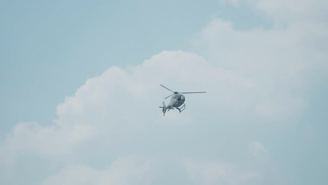Jakarta, Indonesia - April 9, 2023: Indonesian Air Force (TNI AU) EC120B Colibri helicopter performs at the Indonesian Air Force's birthday event at Halim Perdana Kusuma
