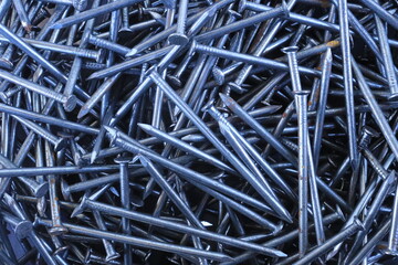 Silver Carpenter's Nails Close-Up Background
