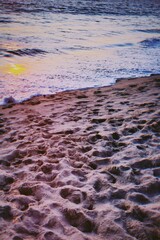waves on the beach at sunset