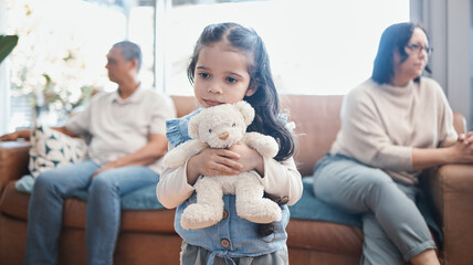 Divorce, mother and father with a sad girl, teddy bear and separation at home, living room and ignore. Parents, mama and dad with daughter, female child with a toy and family with issues and problems