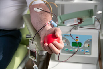 Blood donor at donation, blood transfusion. Also a concept image for World Blood Donor Day - June...