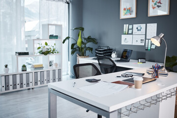 Empty office, interior and workspace with furniture, table and professional layout in startup agency. Background of modern workplace, business building and room in company, job venue or minimal setup