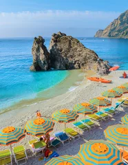 Foto op Plexiglas Liguria Monterosso beach vacation Chairs and umbrellas on the beach of Cinque Terre Italy.