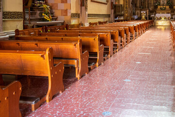 Interior pews of the catholic church in mexico
