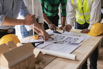 Meeting engineers or architects for projects, working with partners and engineering tools to create workplace models and blueprints. construction concept