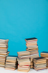 learning library science stack of books on a blue background