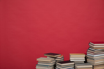 science learning library stack of books on red background