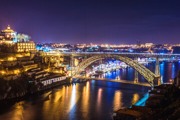 Fototapeta na wymiar Night view of Dom Luis I bridge over Douro River in Port, view with Vila Nova de Gaia cityo, Portugal