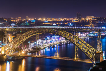 Evening view of Dom Luis I bridge over Douro River in Port, view on Vila Nova de Gaia cityo, Portugal