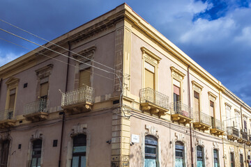 Fototapeta na wymiar Building on Bengasi Street in Syracuse, Sicily, Italy