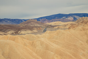 Fototapeta na wymiar Road trip through Death Valley National Park near Las Vegas, Nevada, USA. Unique desert landscape and dunes as far as the eye can see.