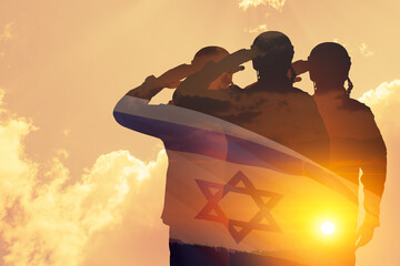 Double exposure of Silhouettes of a soliders and the sunset or the sunrise against Israel flag.