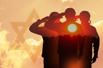 Double exposure of silhouette of a solider and the sunset or the sunrise against sky with silhouette of star of David.