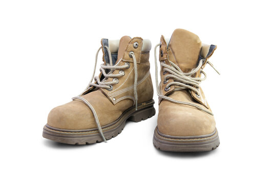 A pair of work boots isolated on a white background.