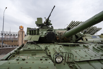 a Russian tank against a gloomy sky in close-up