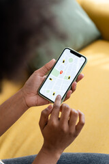 Crop woman using smartphone and checking her delivery