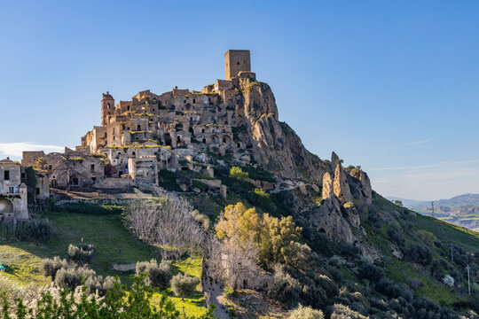 Craco, Basilicata. Abandoned city. A ghost town built on a hill and abandoned due to geological problems. Surreal look, horror film scenery. Panorama of the Calanchi Park.