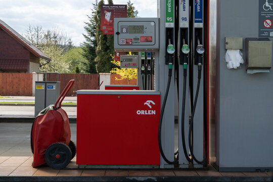 Orlen gas station column. Gasoline pump stand or fuel dispenser machine with nozzles hoses and screen display. Polish self-service petrol filling station on April 24, 2023 in Krzeszowice, Poland.