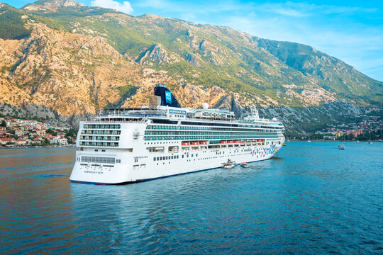 KOTOR, MONTENEGRO - SEPTEMBER 5, 2022: Cruise ship Norwegian Gem of Norwegian Cruise line sailing away  from Kotor, Montenegro.