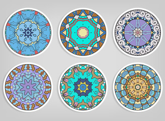 Decorative round ornaments set, isolated elements. Colorful mandala, stylized flower. Abstract geometric doodle patterns for plate decoration, fabric print,  business or greeting card design