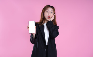 image of asian businesswoman using phone on pink background