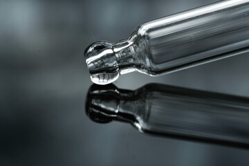 pipette on gradient background. Concept of making researches in care cosmetics. Hyaluronic acid,...