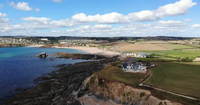 Aerial View Of Sea Lavender Cottage On Devon Headland Overlooking the English Channel. Parallax Shot