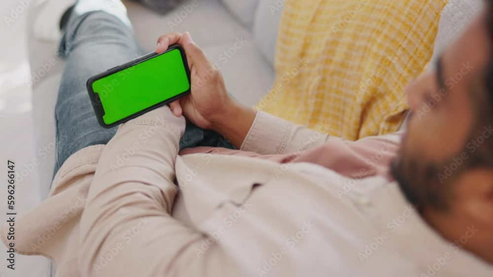 Poster man, smartphone and green mockup screen on sofa to relax on social media, online post and streaming.