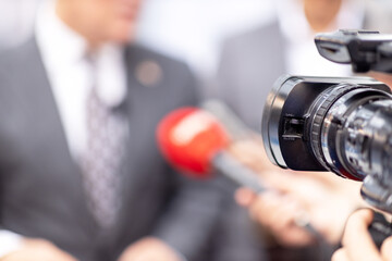 Filming media interview, news or press conference with a video camera