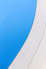 abstract photograph of sailboat sails against the sky. Minimalism, space for copy text.