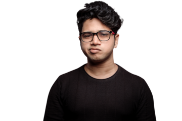 PNG of A grumpy face young man is looking over his spectacles with a rude expression of shock and disapproval on his face isolated on a transparent PNG background.