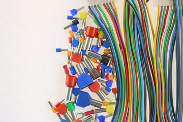 Metal tips with colored insulators for connecting copper electrical wires. Close-up.