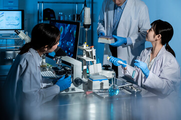 Professional health care researchers working in a medical science laboratory, technology of...
