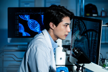Portrait of a young Asian man conducting a scientific experiment in a laboratory.