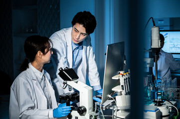 Professional health care researchers working in a medical science laboratory, technology of...
