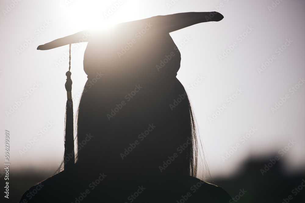 Poster We dont know what the future holds. Rearview shot of a woman wearing a graduation hat.