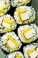 Vegan sushi with tofu, avocado and mango. Healthy food