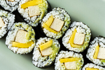 Vegan sushi with tofu, avocado and mango. Healthy food