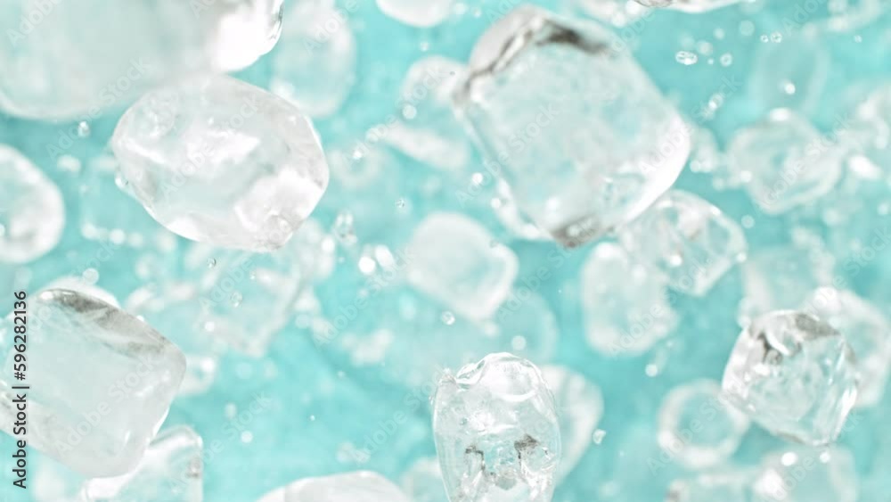 Fototapete Super slow motion of rotating ice cubes, top view shot. Filmed on high speed cinema camera, 1000 fps, placed on high speed cine bot, following the object. Speed ramp effect.