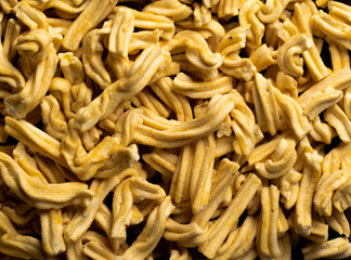 Gathiya is a popular Gujarati tea time snacks. Gathiya is made of gramflour moulded into strips and deep fried.