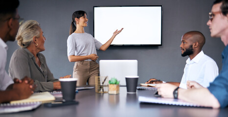 Everyone is moving forward together. Shot of an young businesswoman giving a presentation during a meeting in the boardroom.