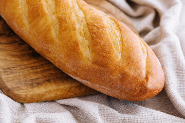 A loaf of bread on a wooden board