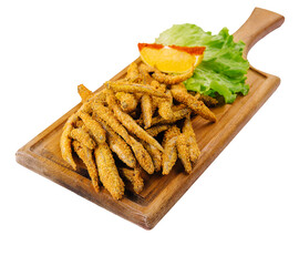 Crispy breaded european smelt fish on wooden board