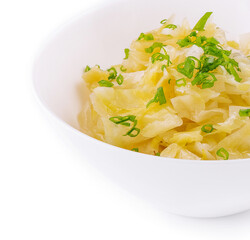 Bowl of tasty fermented cabbage on white