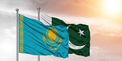 Flags of Pakistan and Kazakhstan friendship flag waving on the sky with beautiful sky.
