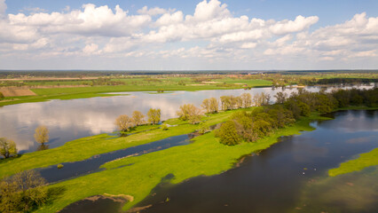 Landscape with river, with clouds in spring, drone
