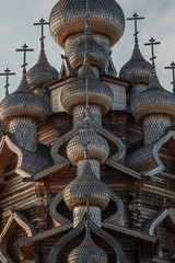 A monument of wooden architecture, a wooden church with many domes. Kizhi Island, Karelia, northern Russia. - 596300957