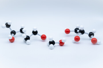Different alcohol molecules made by molecular model on white background. Methanol, ethanol,...