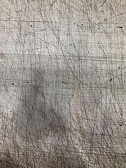 Scratched surface of a glossy cutting board